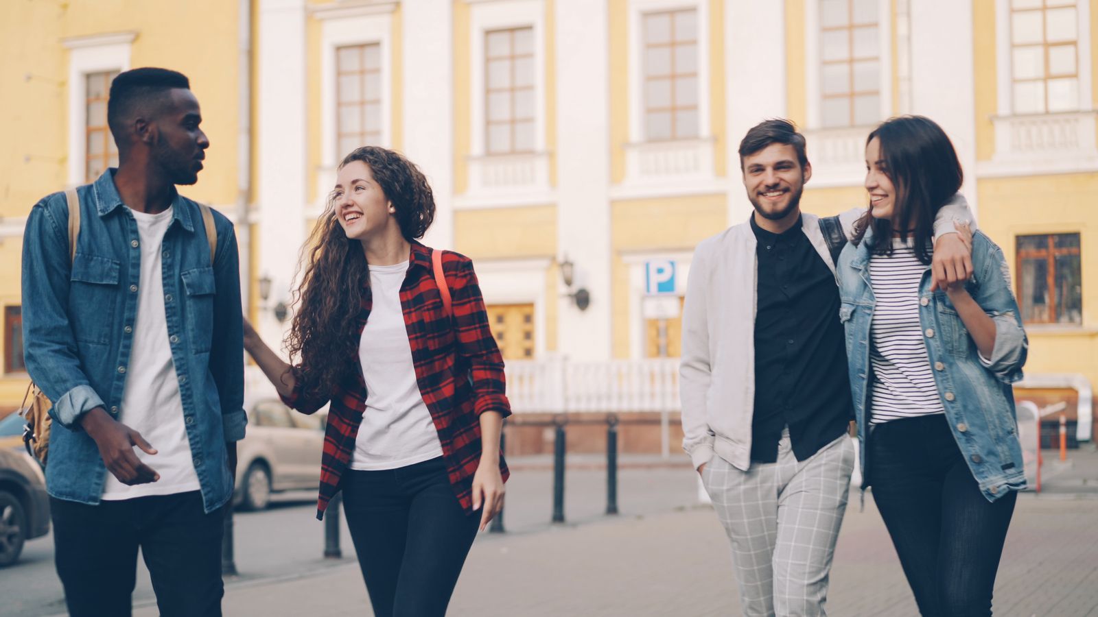 Diverse group of friends walking and talking