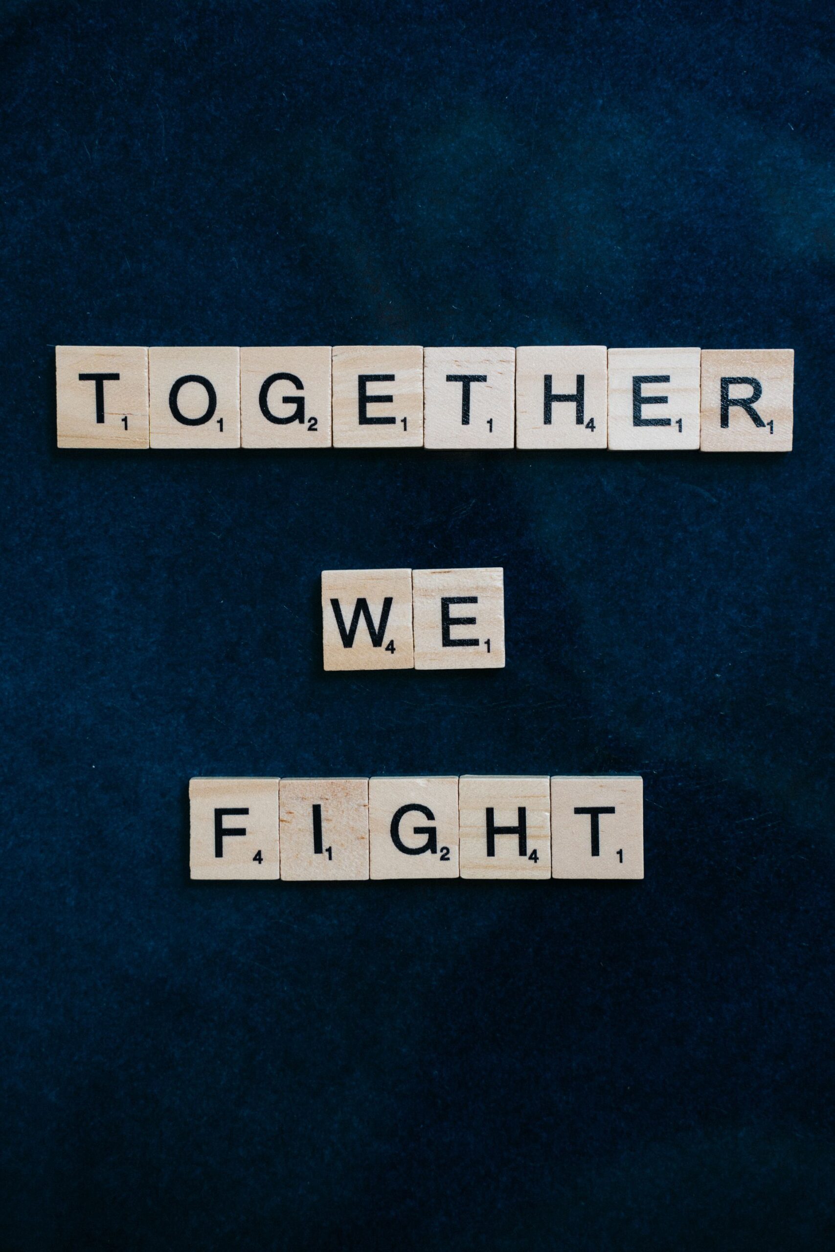 Top view of a slogan spelled in Scrabble tiles