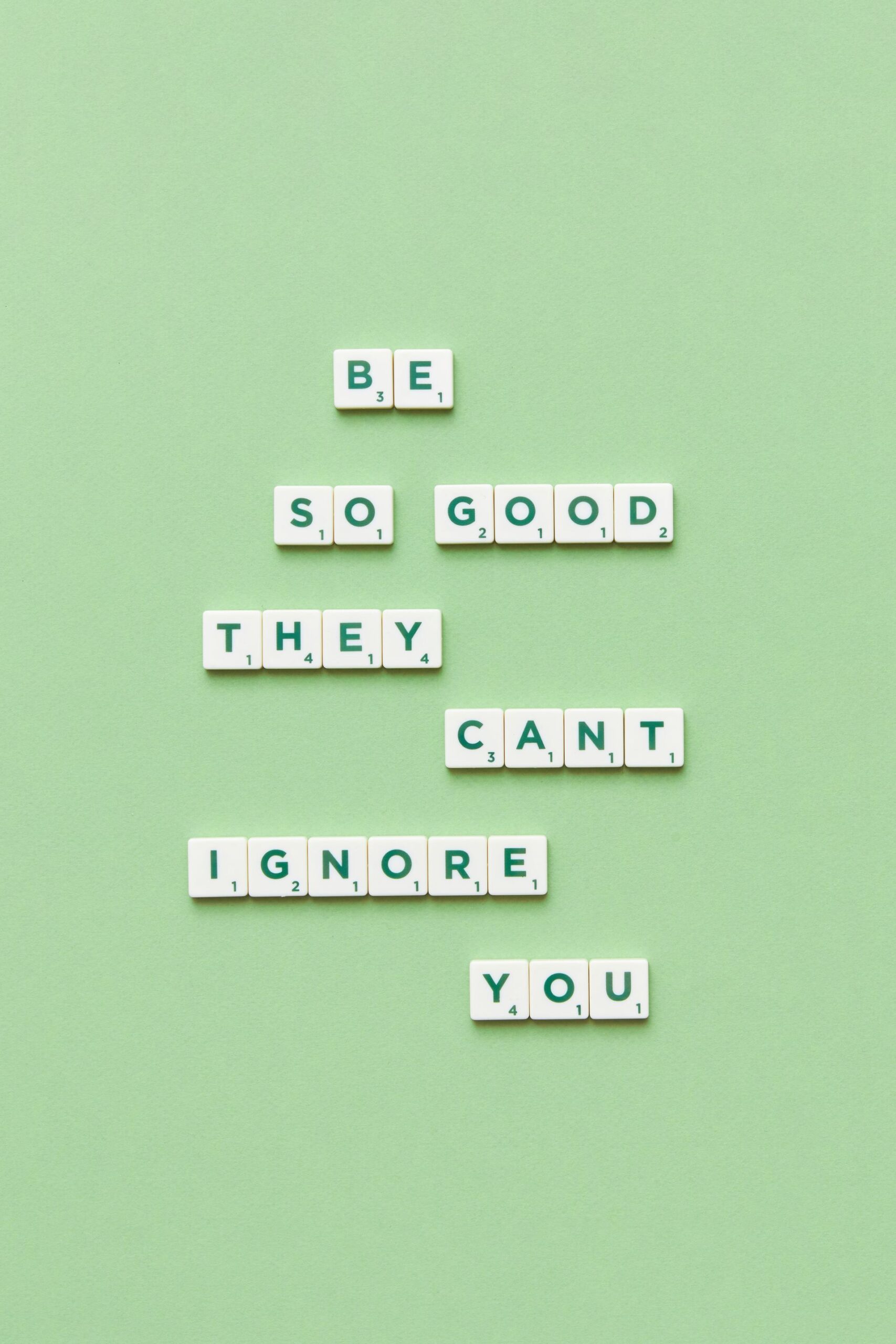 Close-up of an inspirational motto made of Scrabble letters