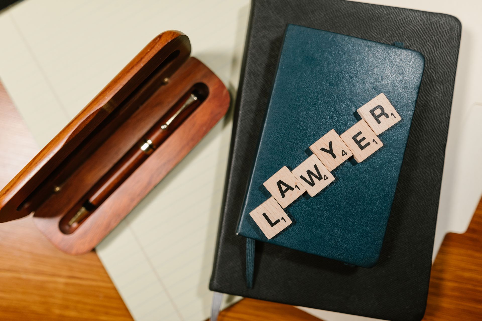 Overhead shot of Scrabble tiles arranged on a notebook