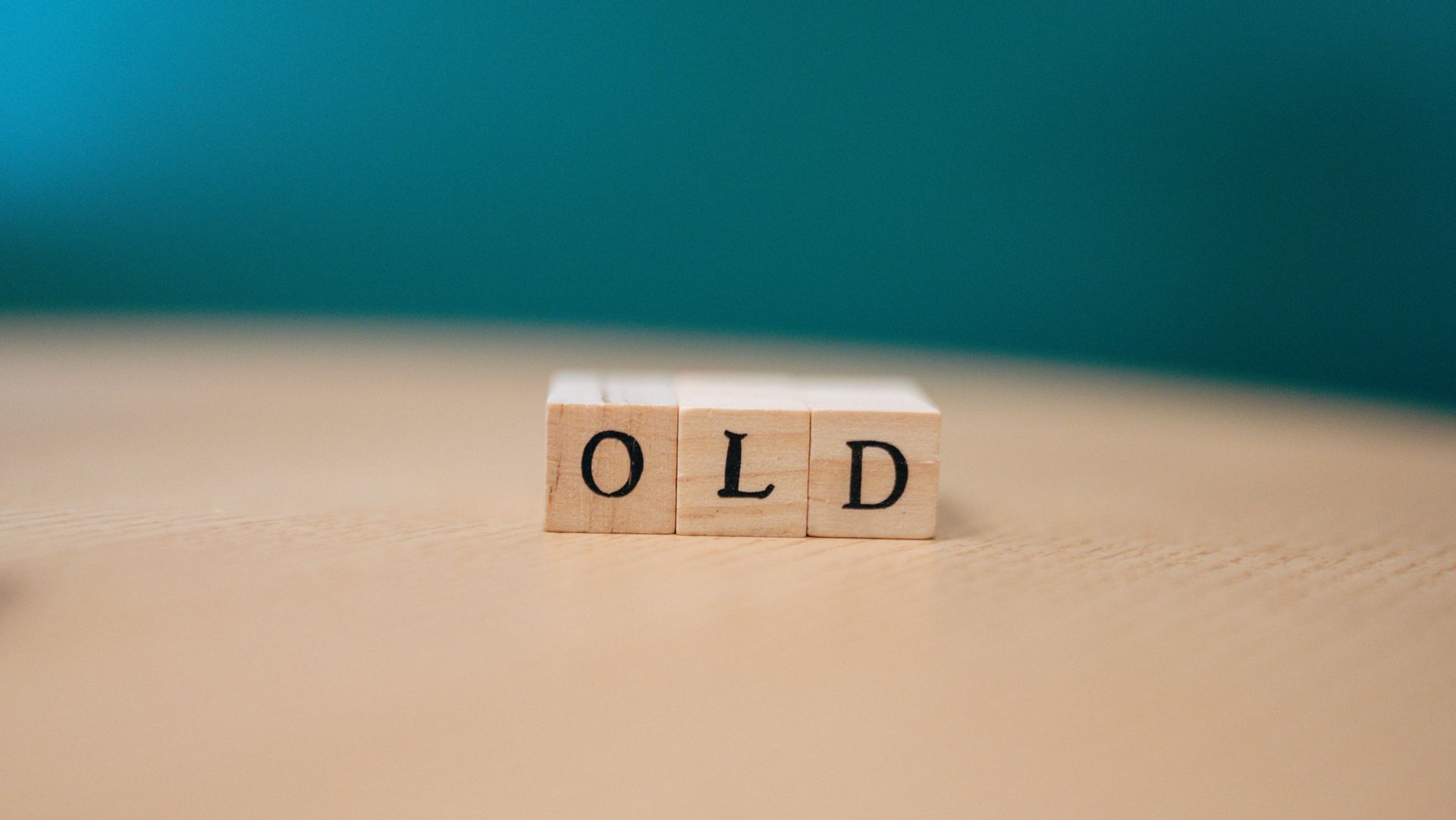 Close-up of wooden blocks spelling the word OLD