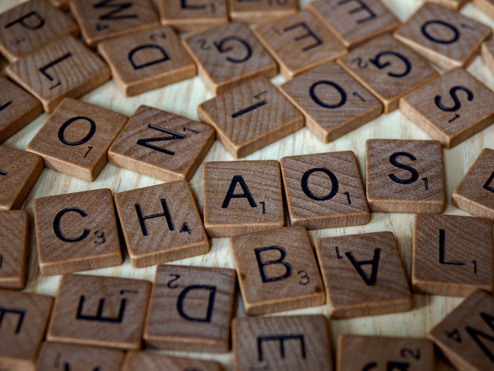Word game tiles on a wooden table