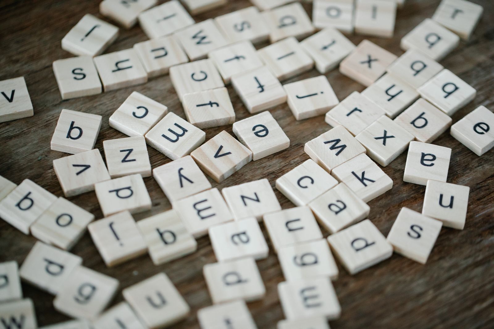 Word game tiles on a wooden table