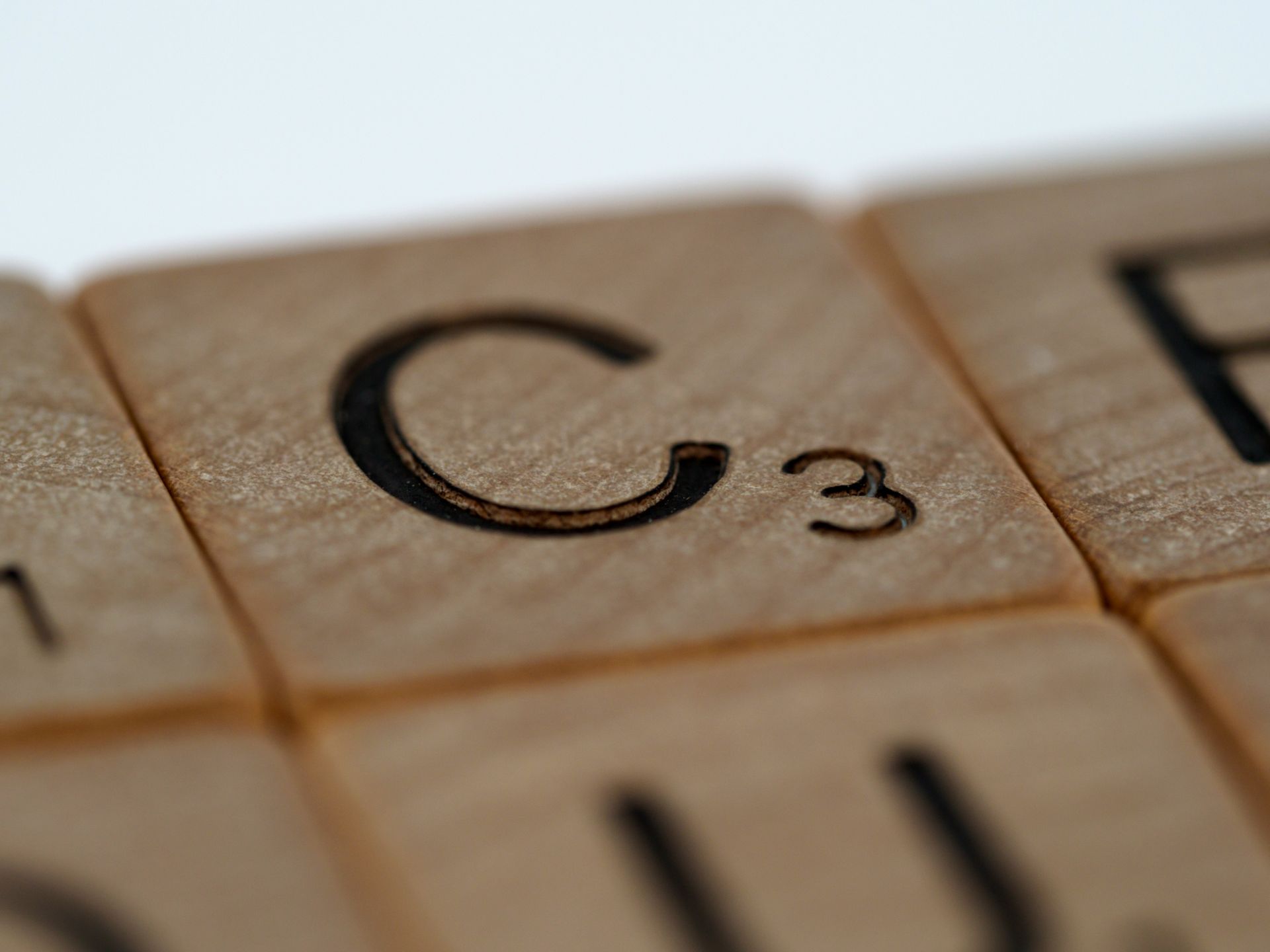 Close-up of a C Scrabble tile