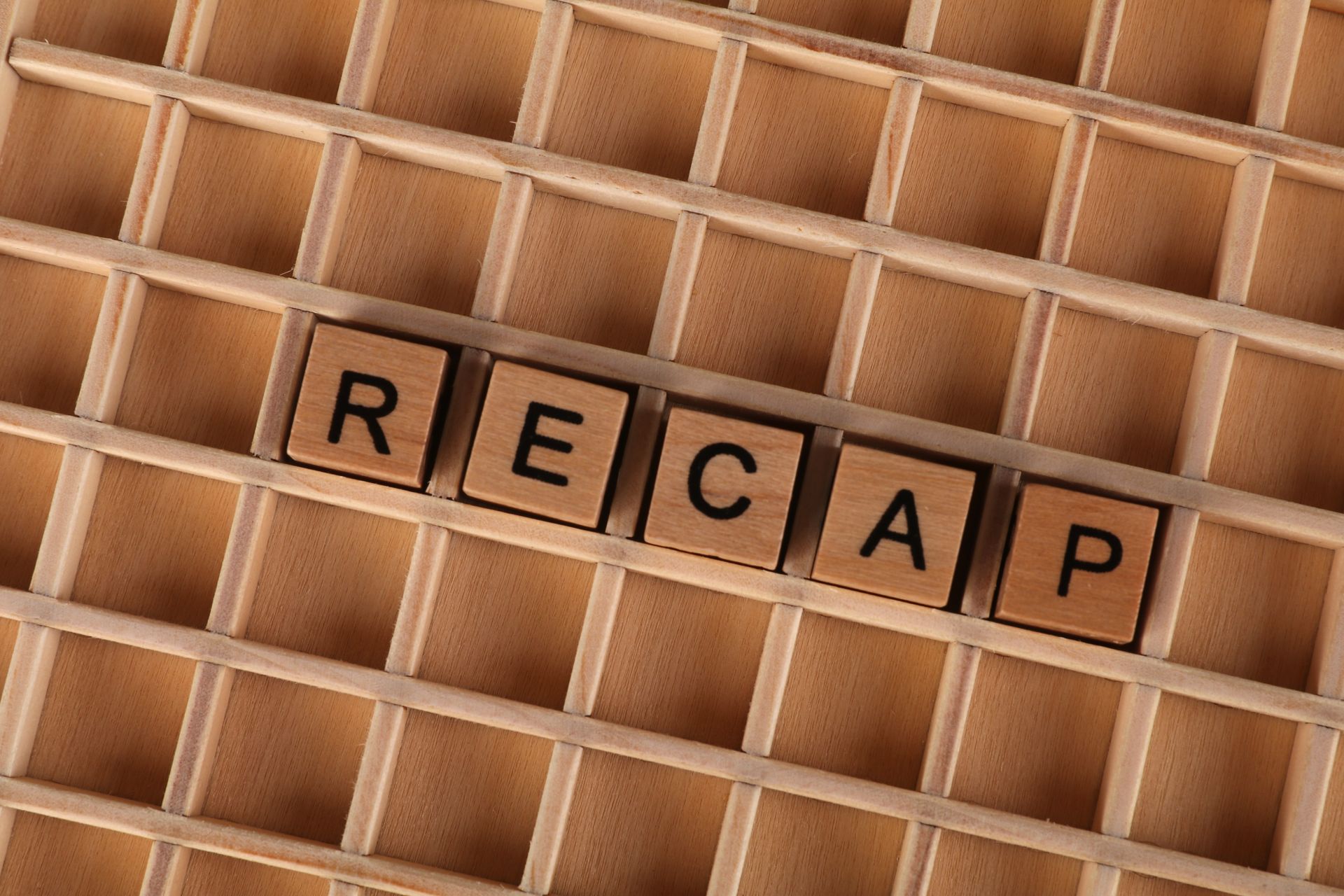 Wooden letter blocks on a grid