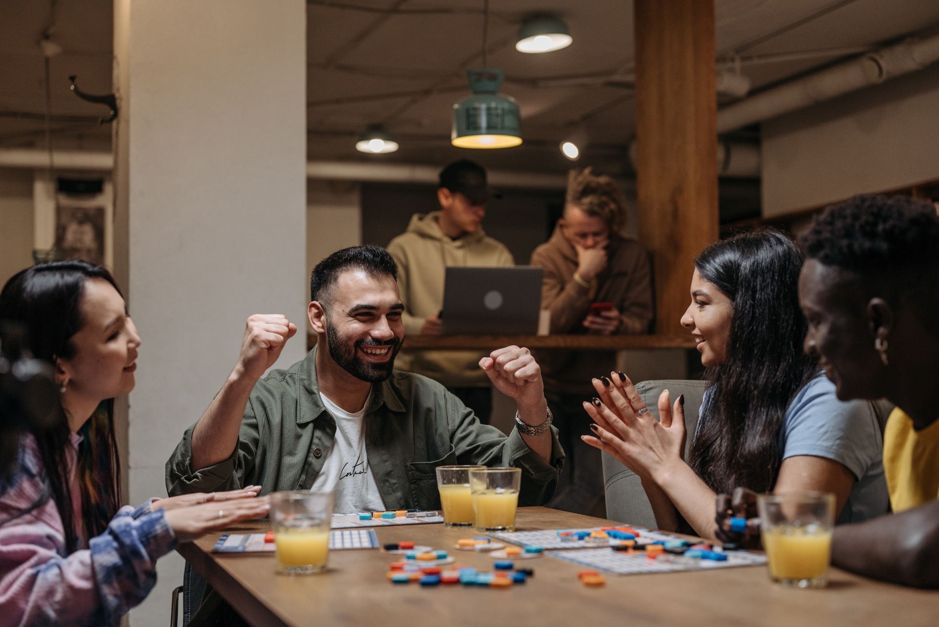 Friends playing a board game and laughing