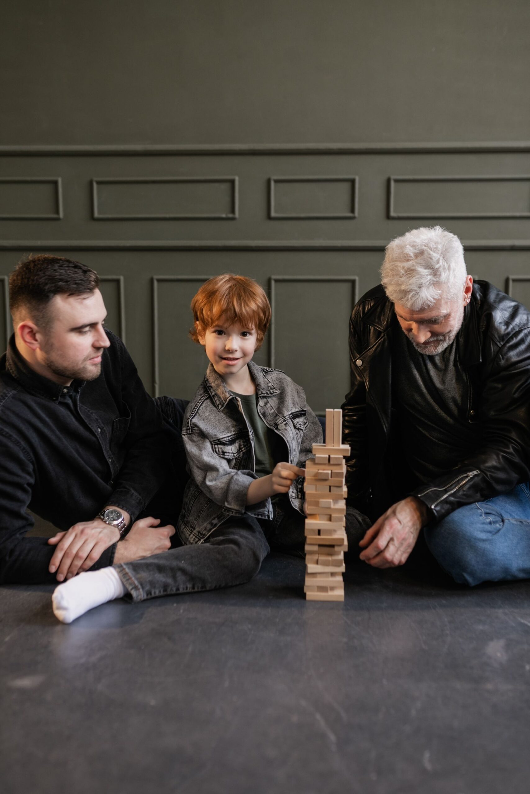 Family playing a board game together indoors