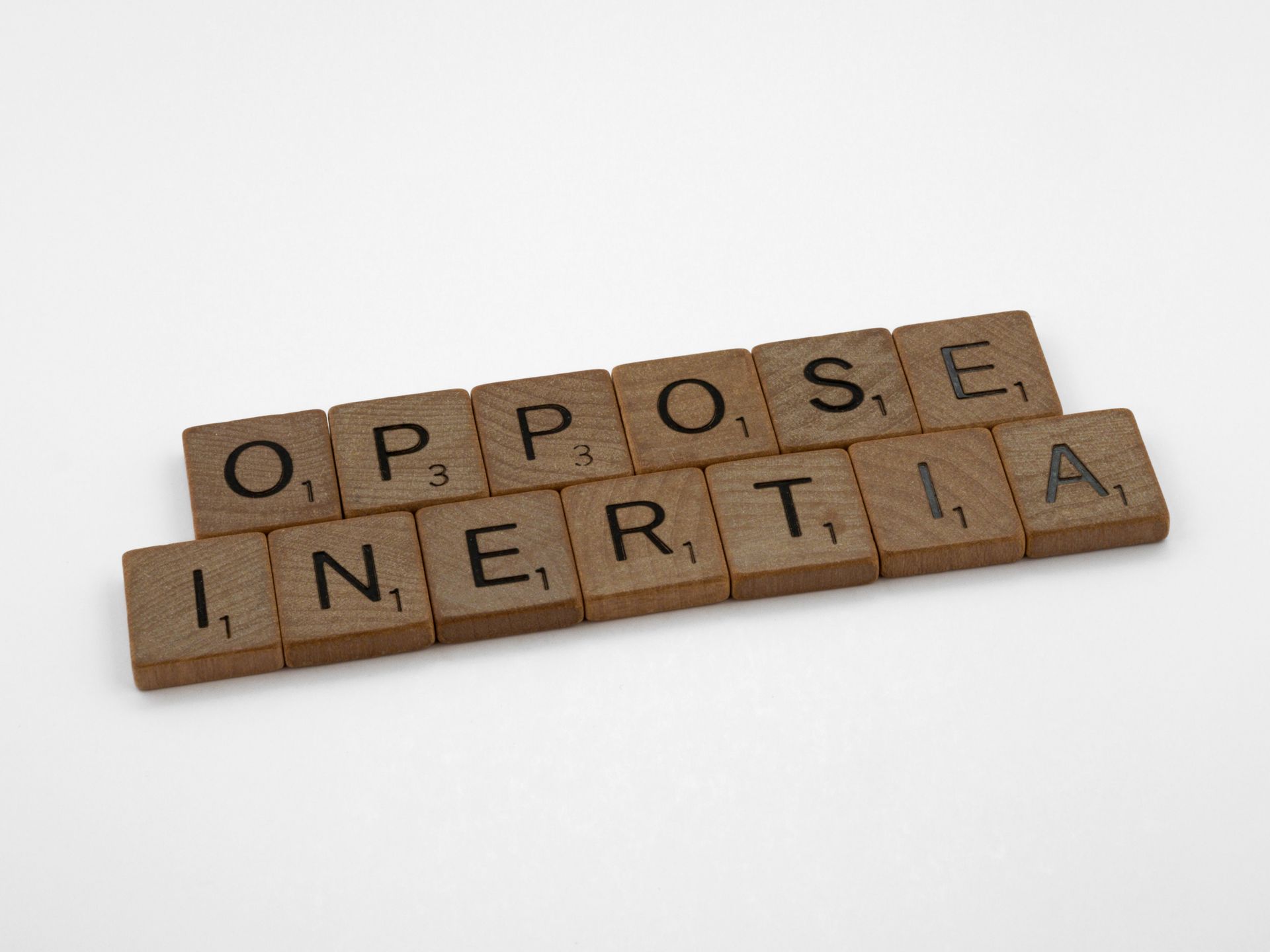 Scrabble tiles spelling words on a white surface