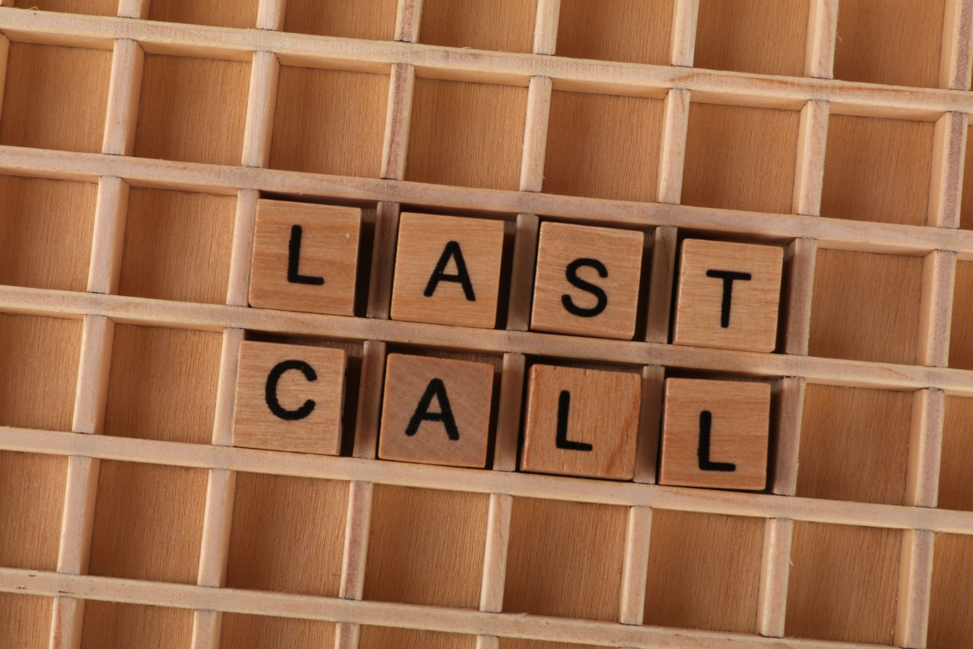 Wooden letter tiles spelling a phrase on a wooden background