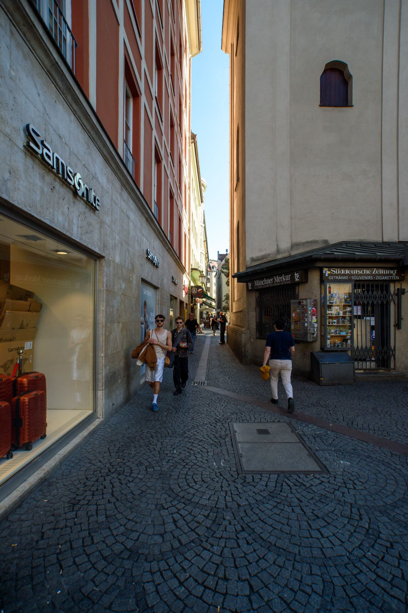 European shopping street with shops and pedestrians