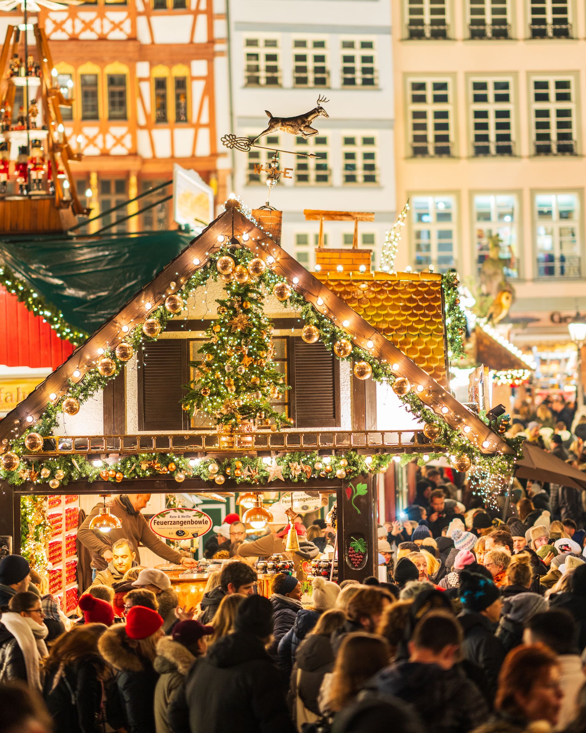 Christmas market filled with people and festive decorations