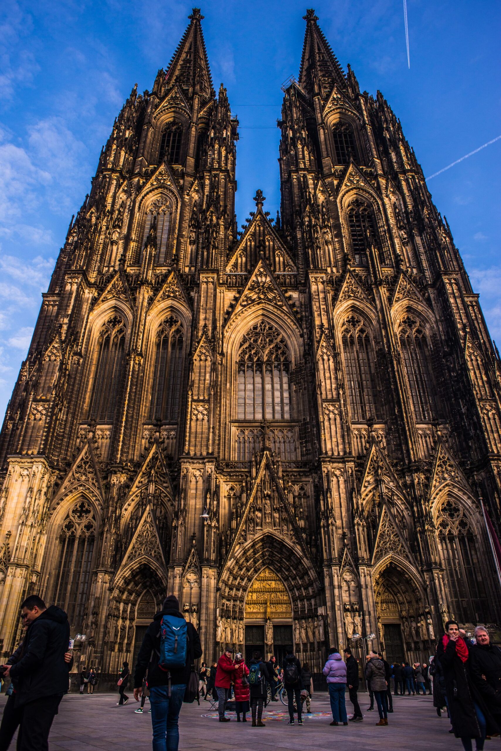 Cologne Cathedral with people at sunset, low angle view