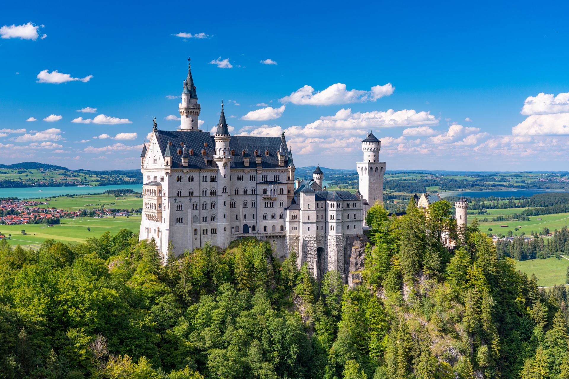 Neuschwanstein Castle under a clear blue sky in Bavaria