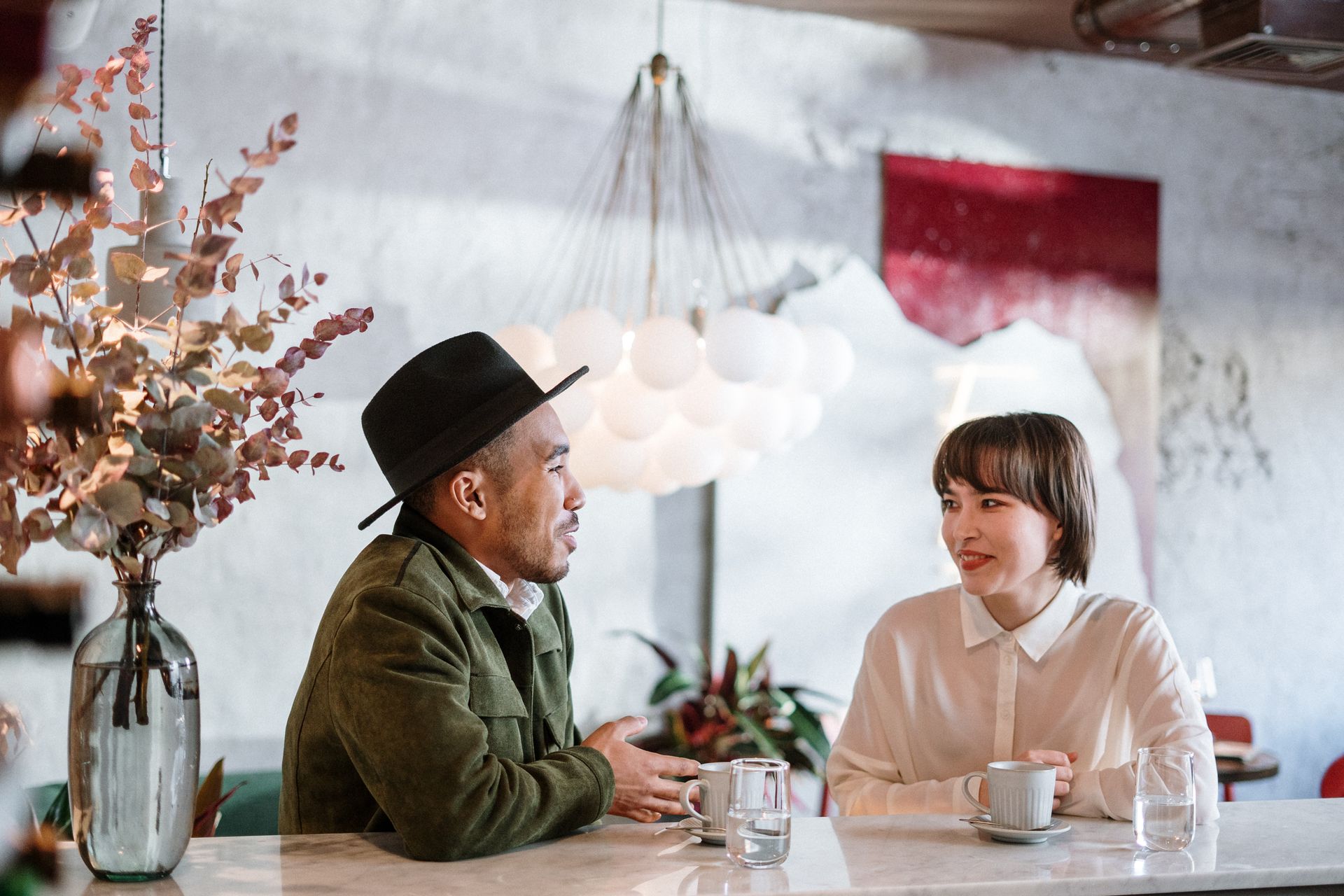 Friendly chat between people in a stylish café