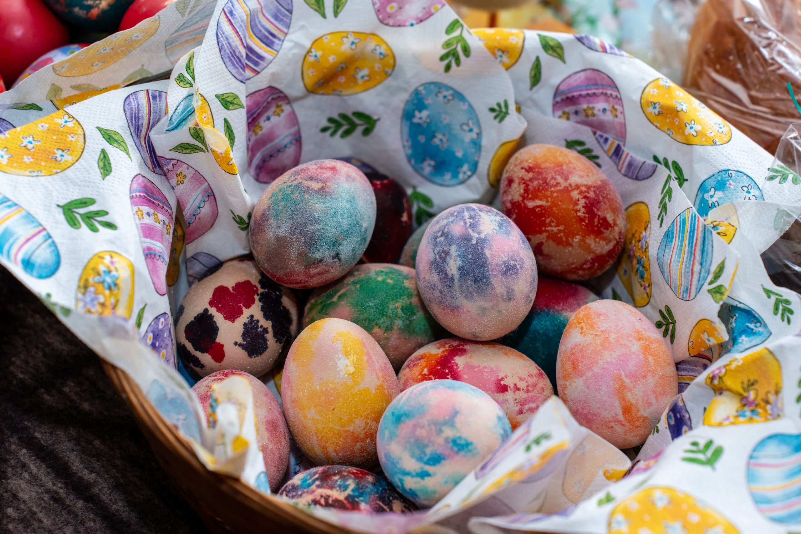 Colorful painted Easter eggs in festive basket