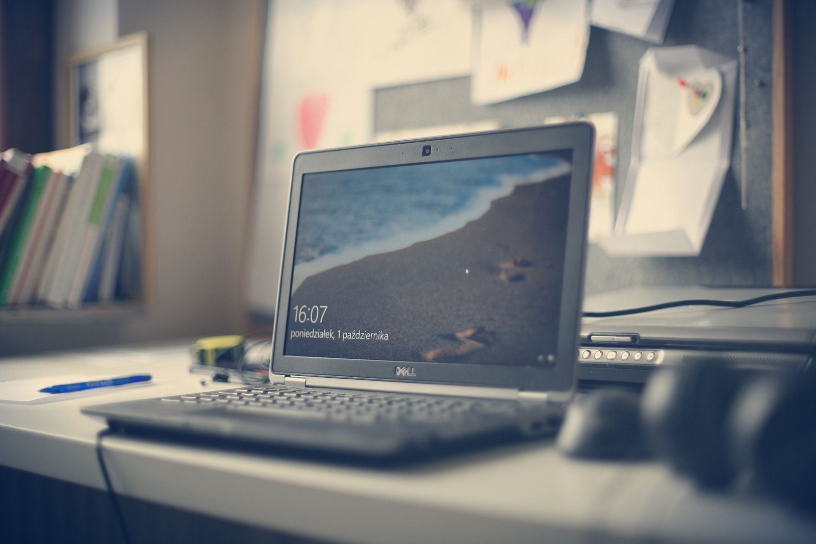 Black Dell laptop on a white desk