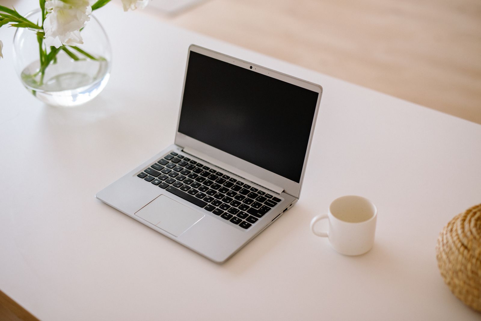 Silver laptop on a white table