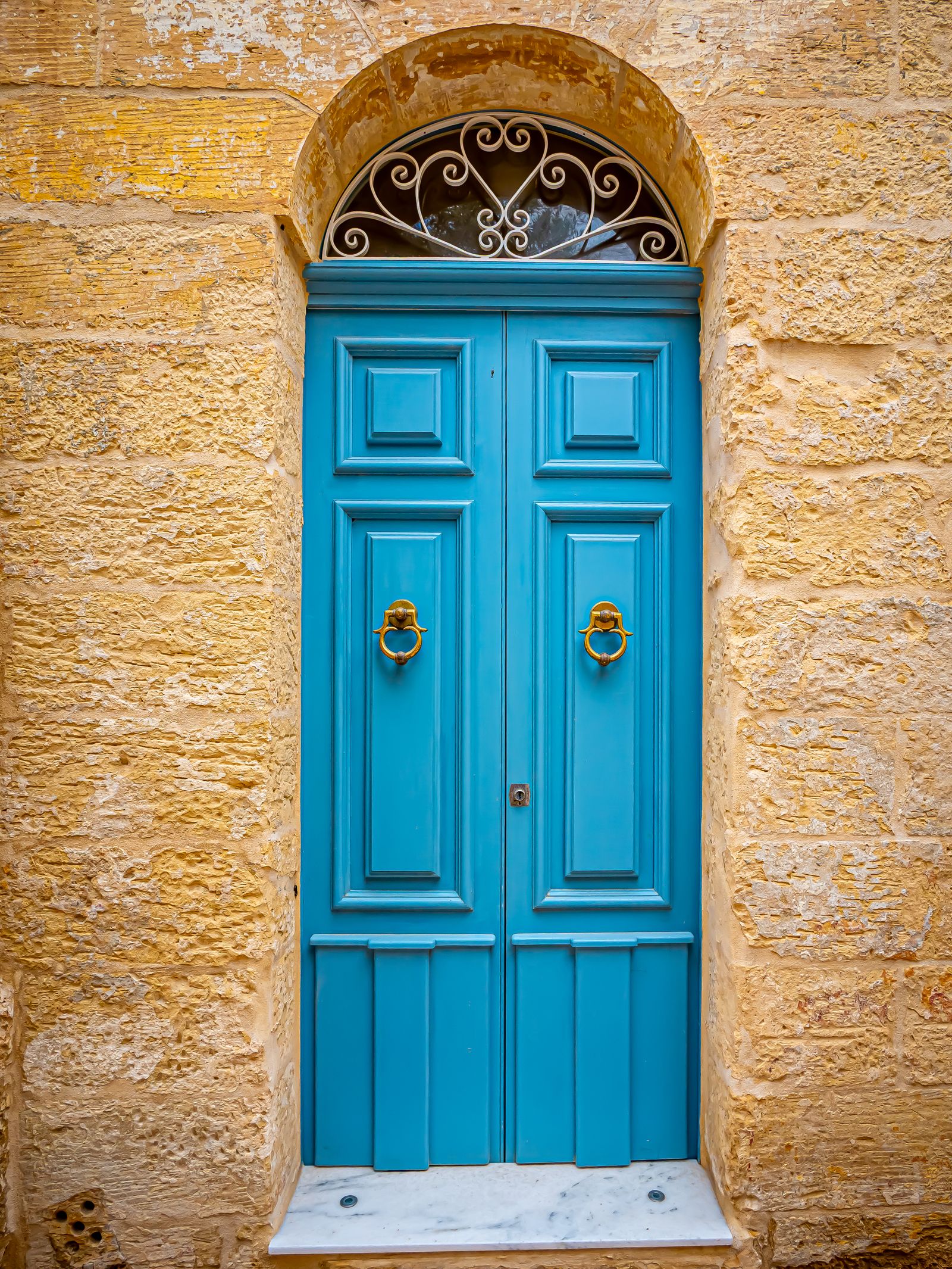 Two identical wooden doors side by side