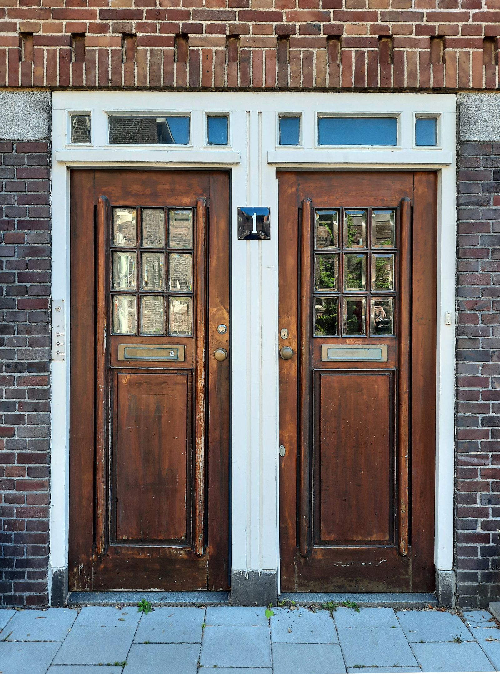 Two identical wooden doors side by side