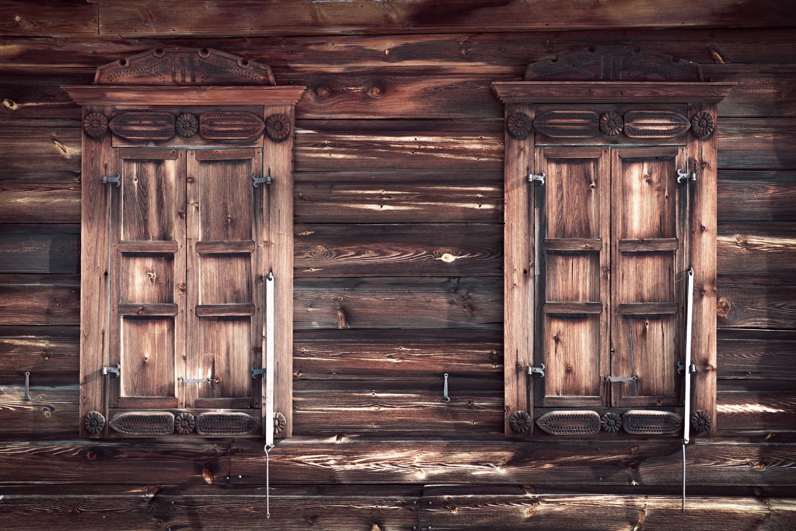 Two identical wooden doors side by side