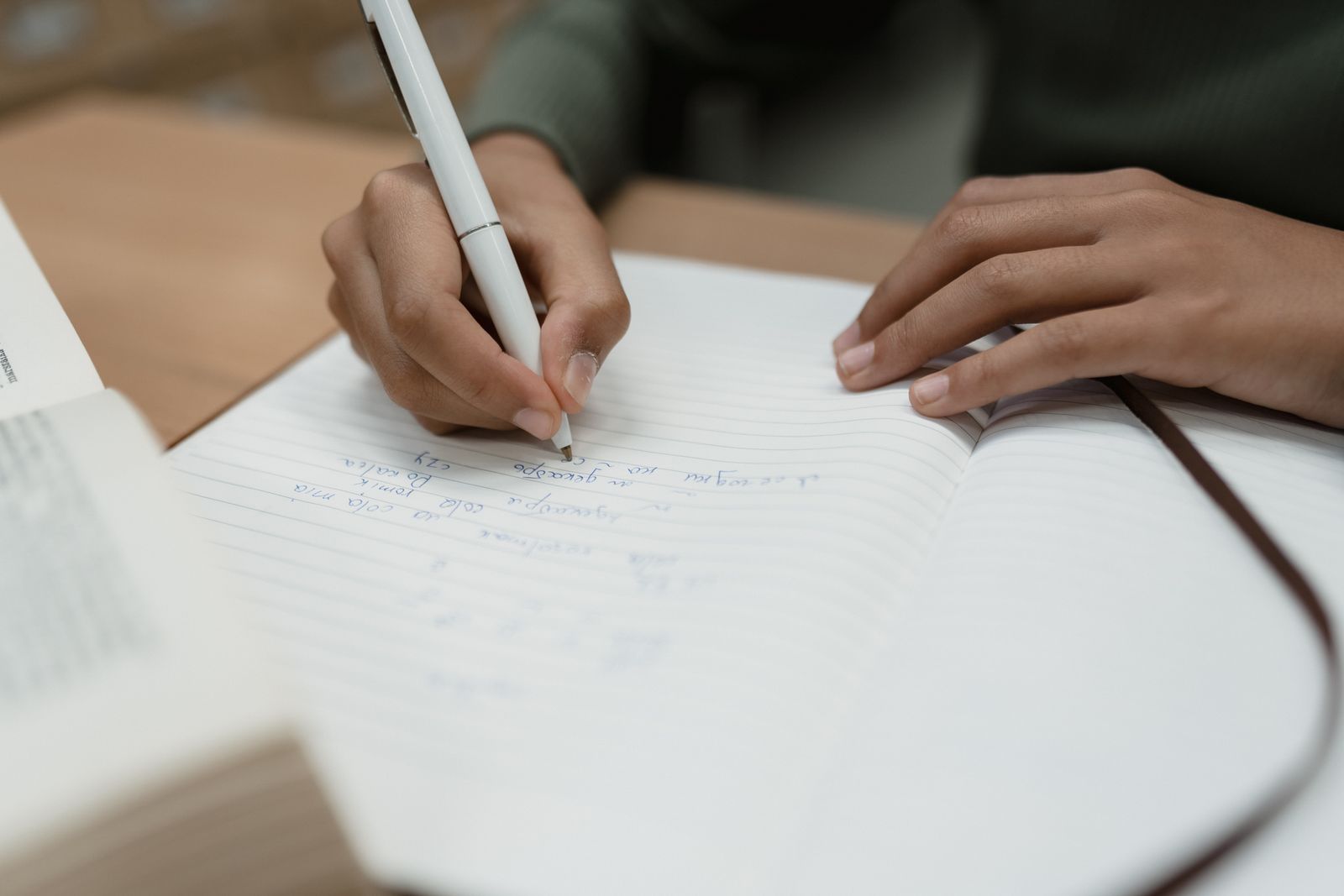 Student reviewing grammar rules in a notebook