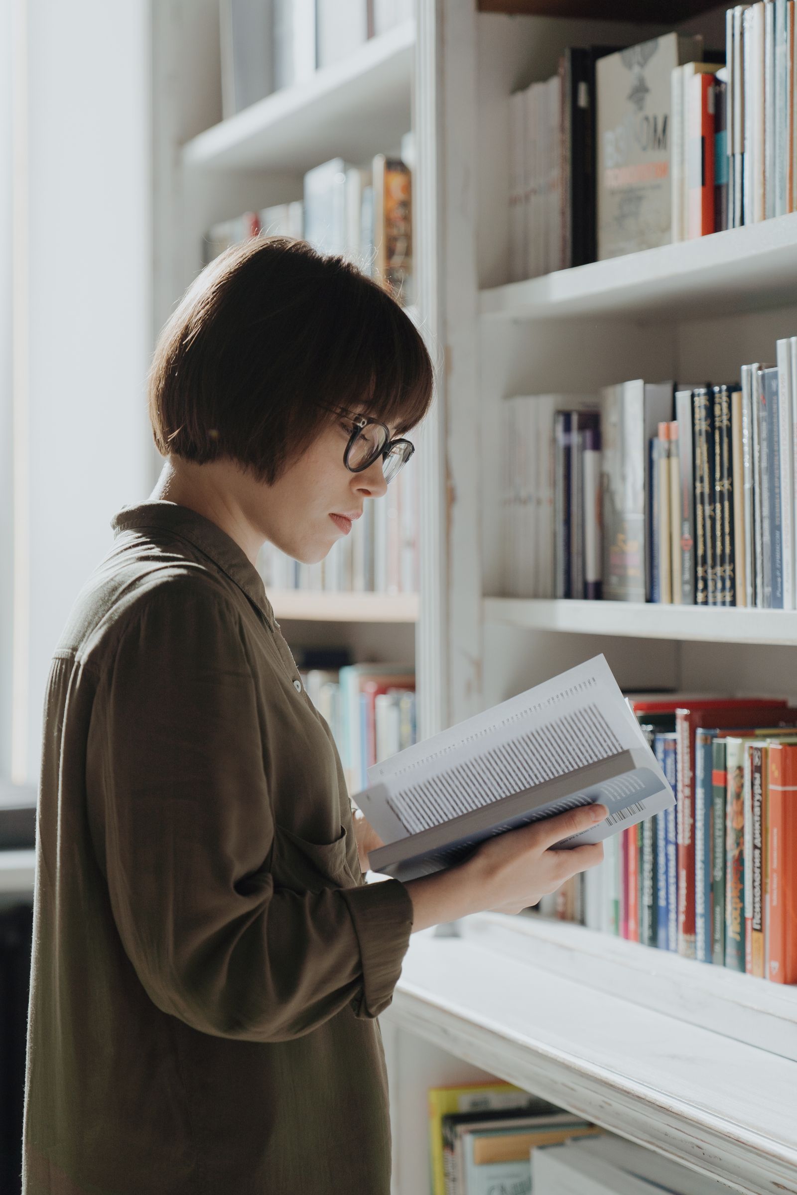 Woman holding an open book while reading