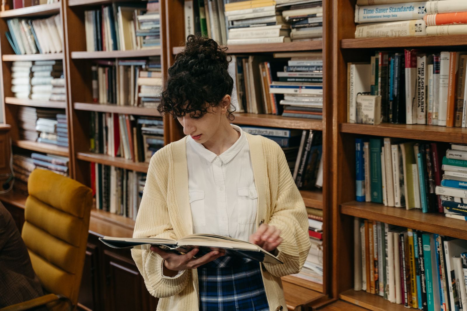 Close-up of woman reading a hardcover book