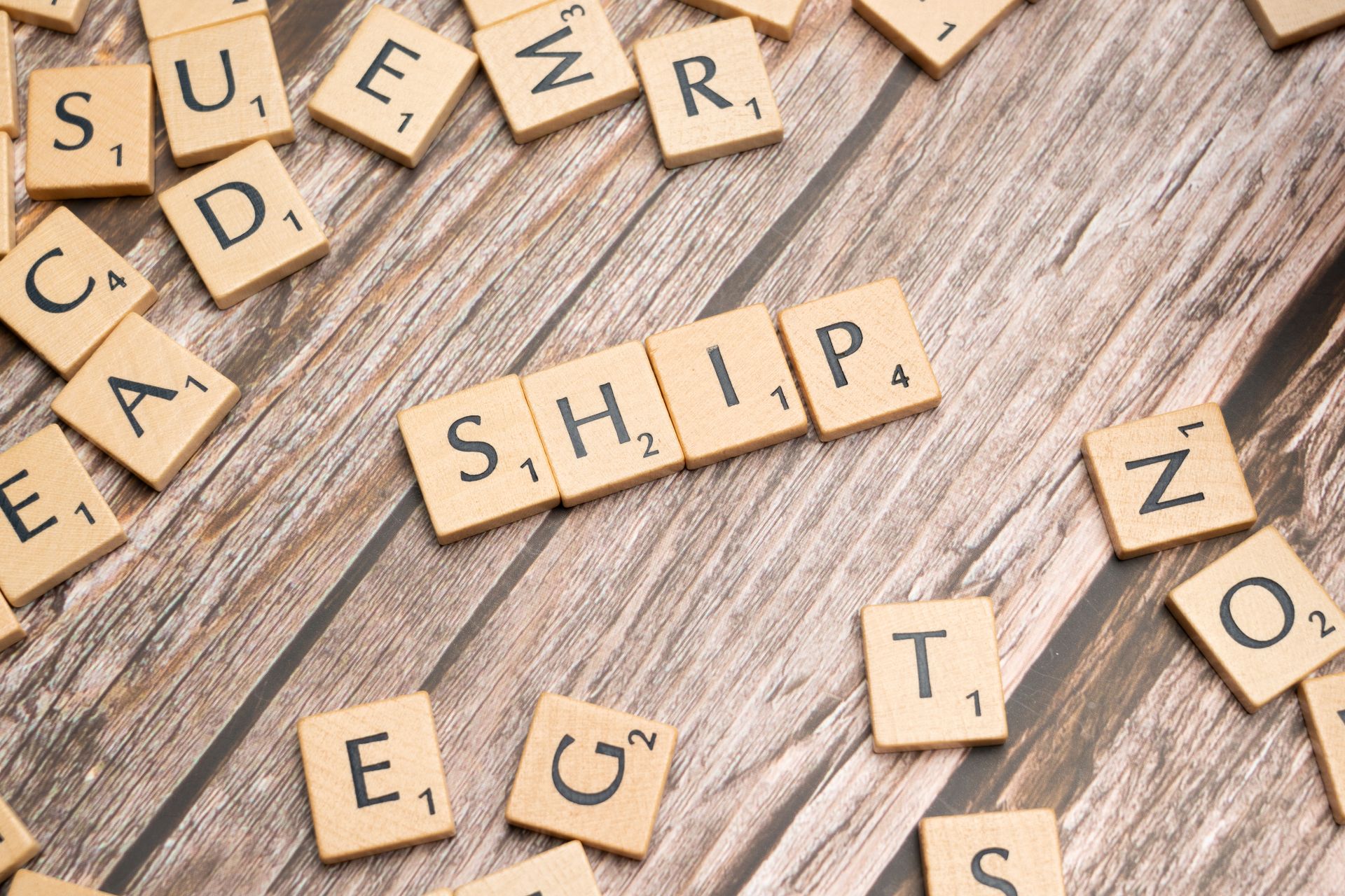 Wooden Scrabble letters spelling the German word Schiff