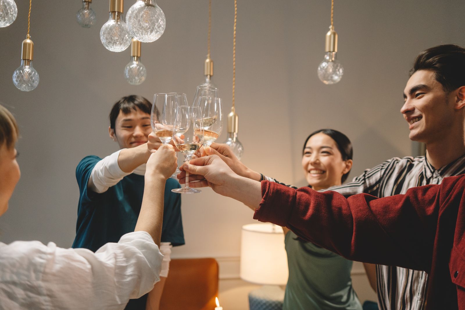 Friends toasting with wine glasses — Prost! / zum Wohl!