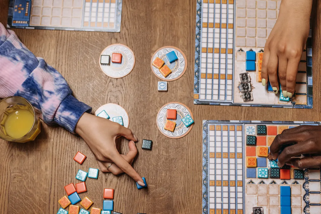 Friends playing a board game together