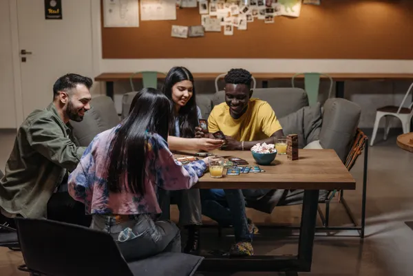 Board game pieces on a table during game night
