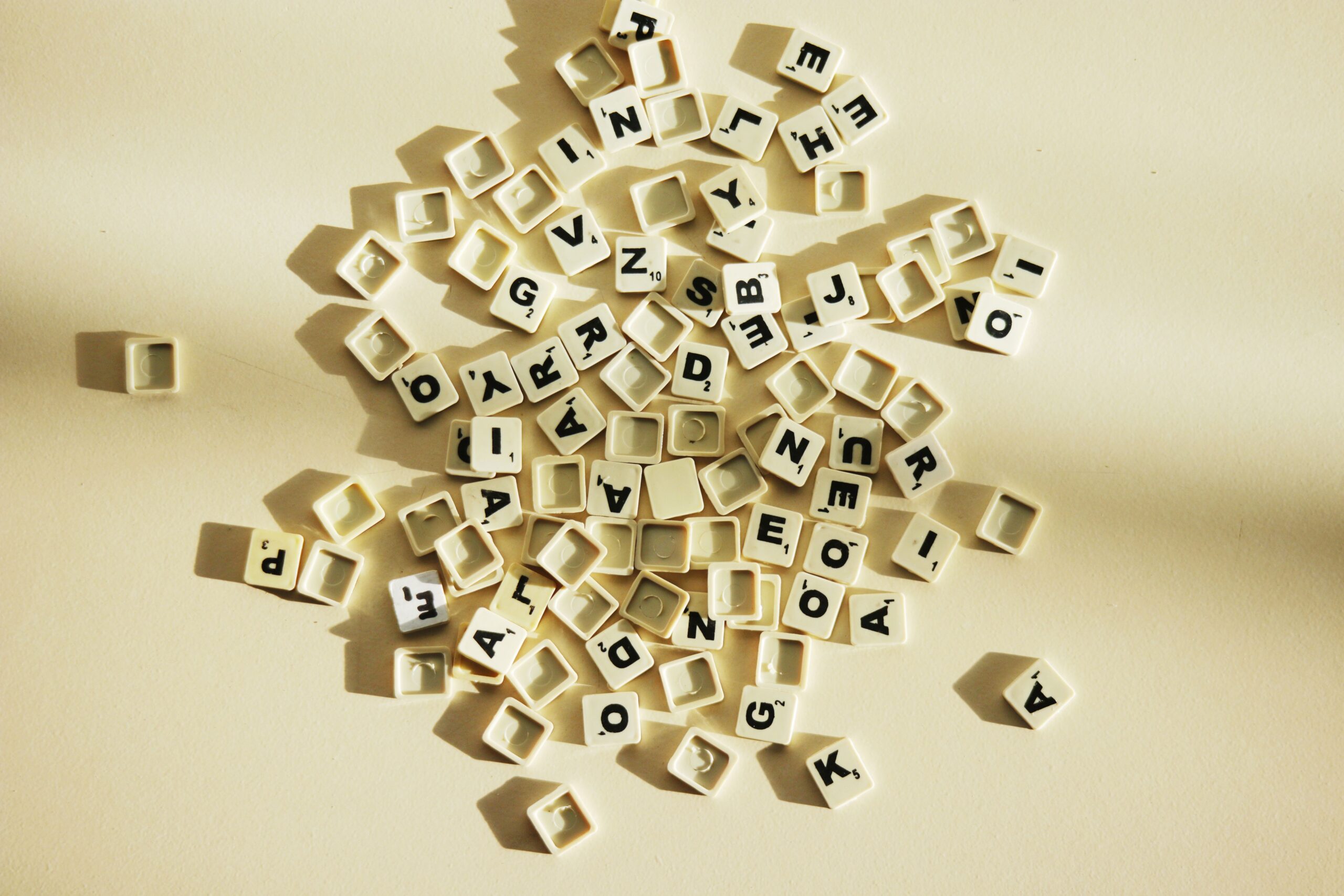 White Scrabble tiles on a white background