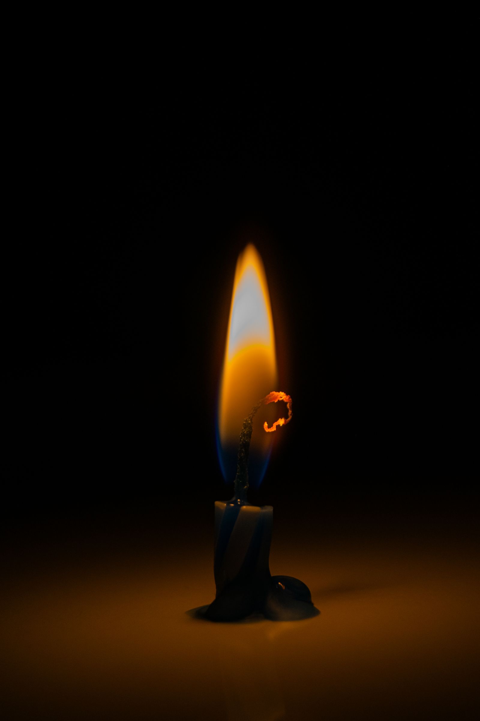 Candle flame in a dark room