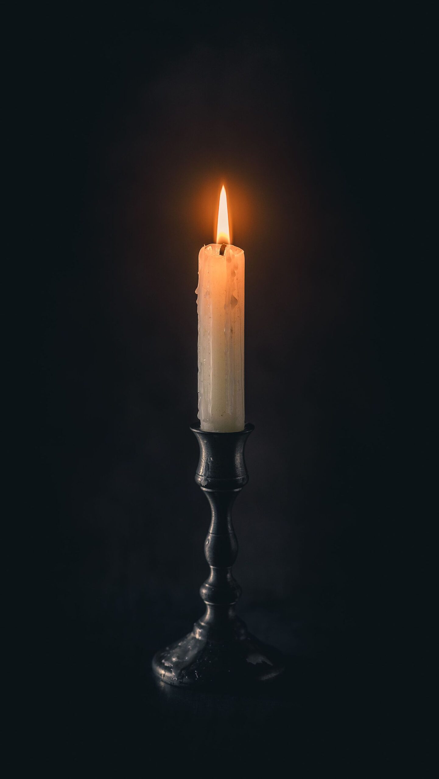 Candles creating warm light in darkness
