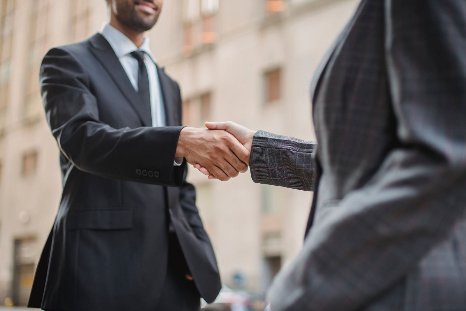 Business handshake in an office