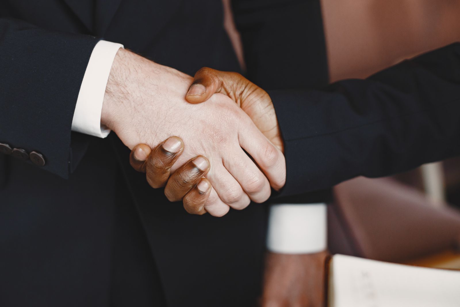 Colleagues shaking hands after a meeting