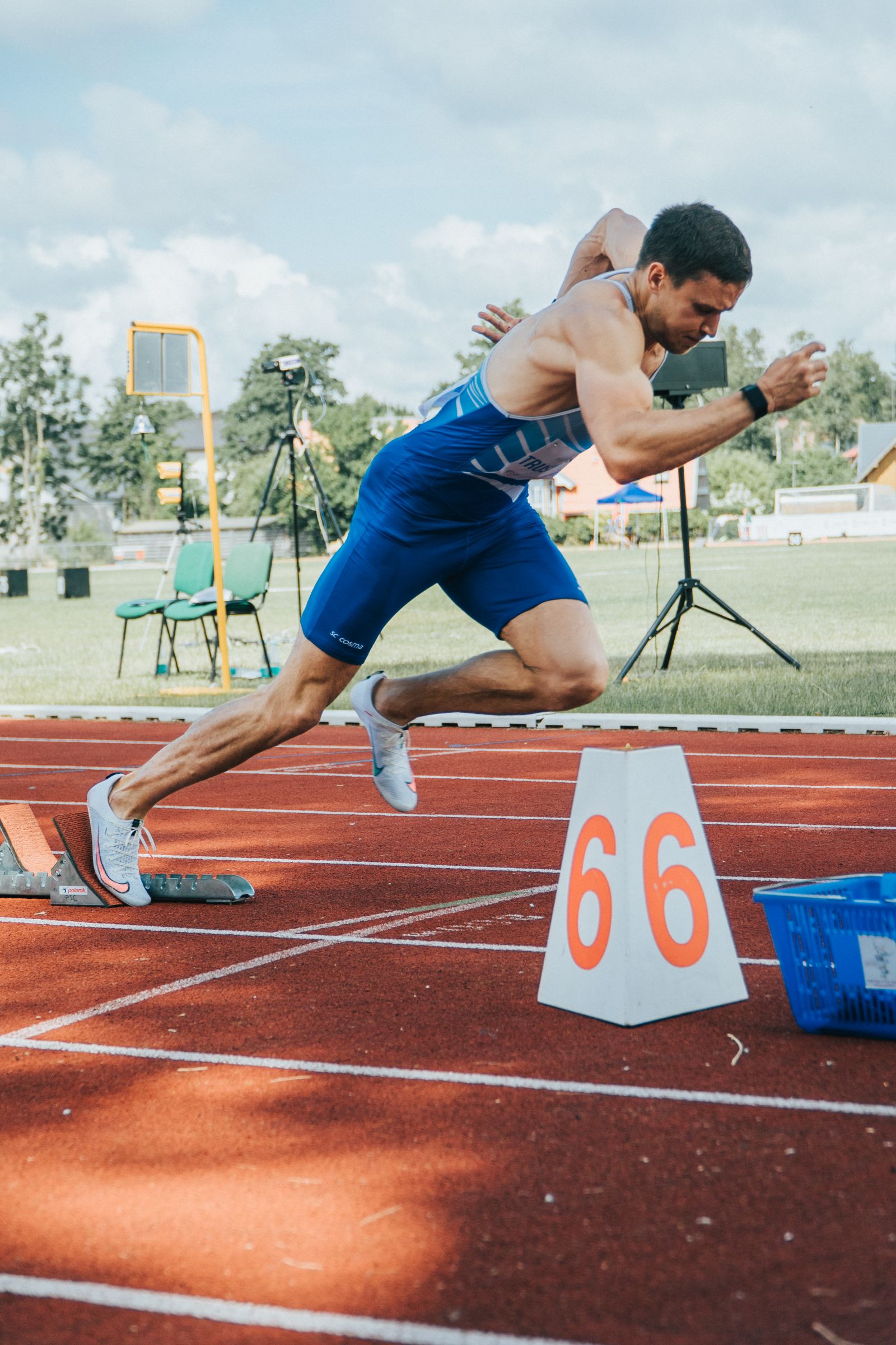 Athlete running fast on a sports track
