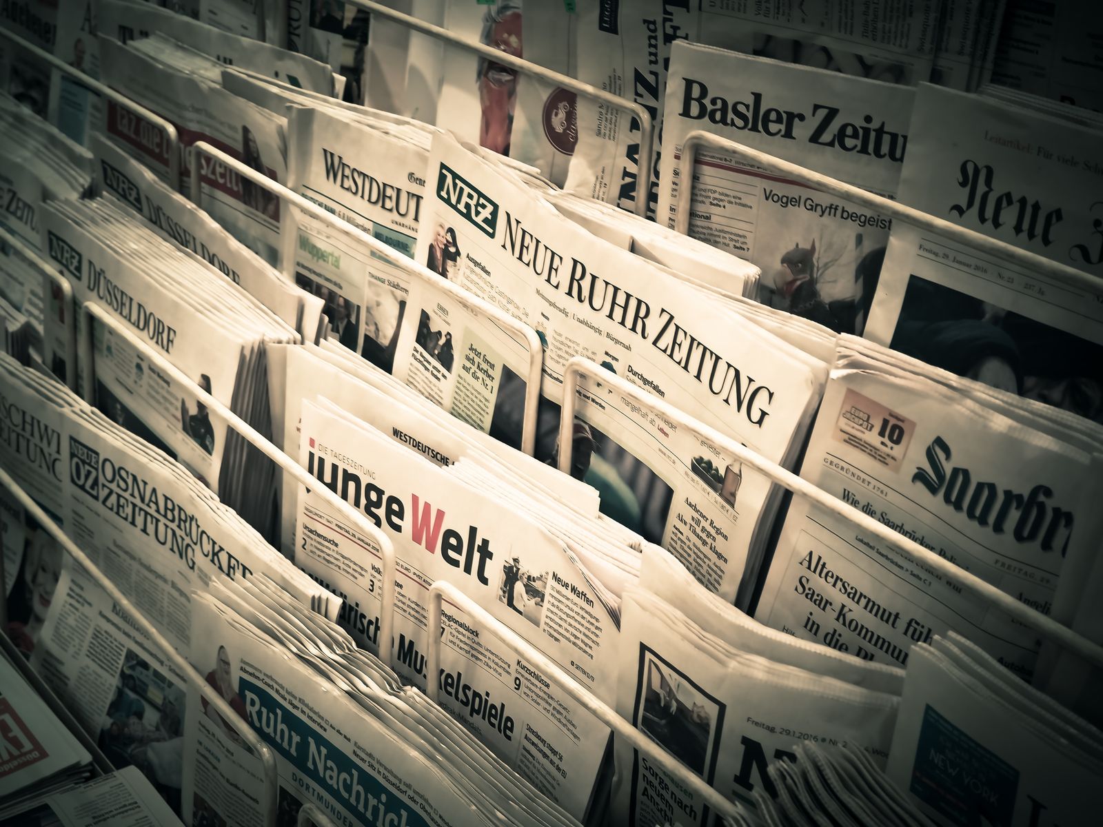 Rolled newspapers tied with string