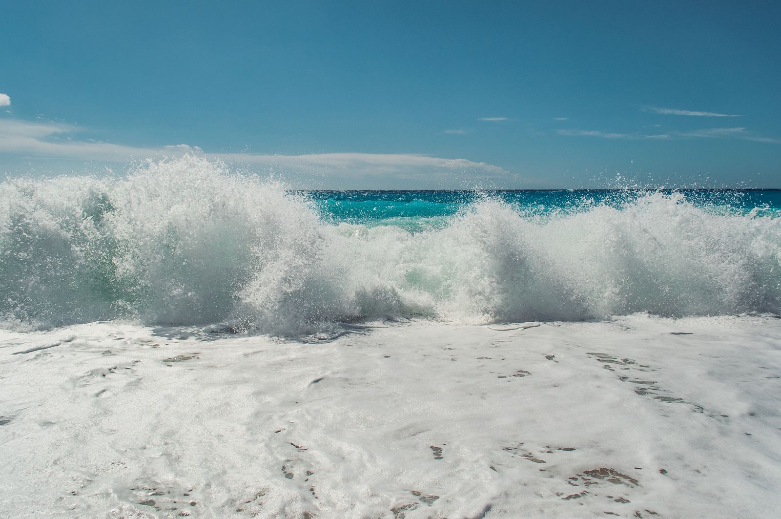 Ocean waves rolling onto the beach