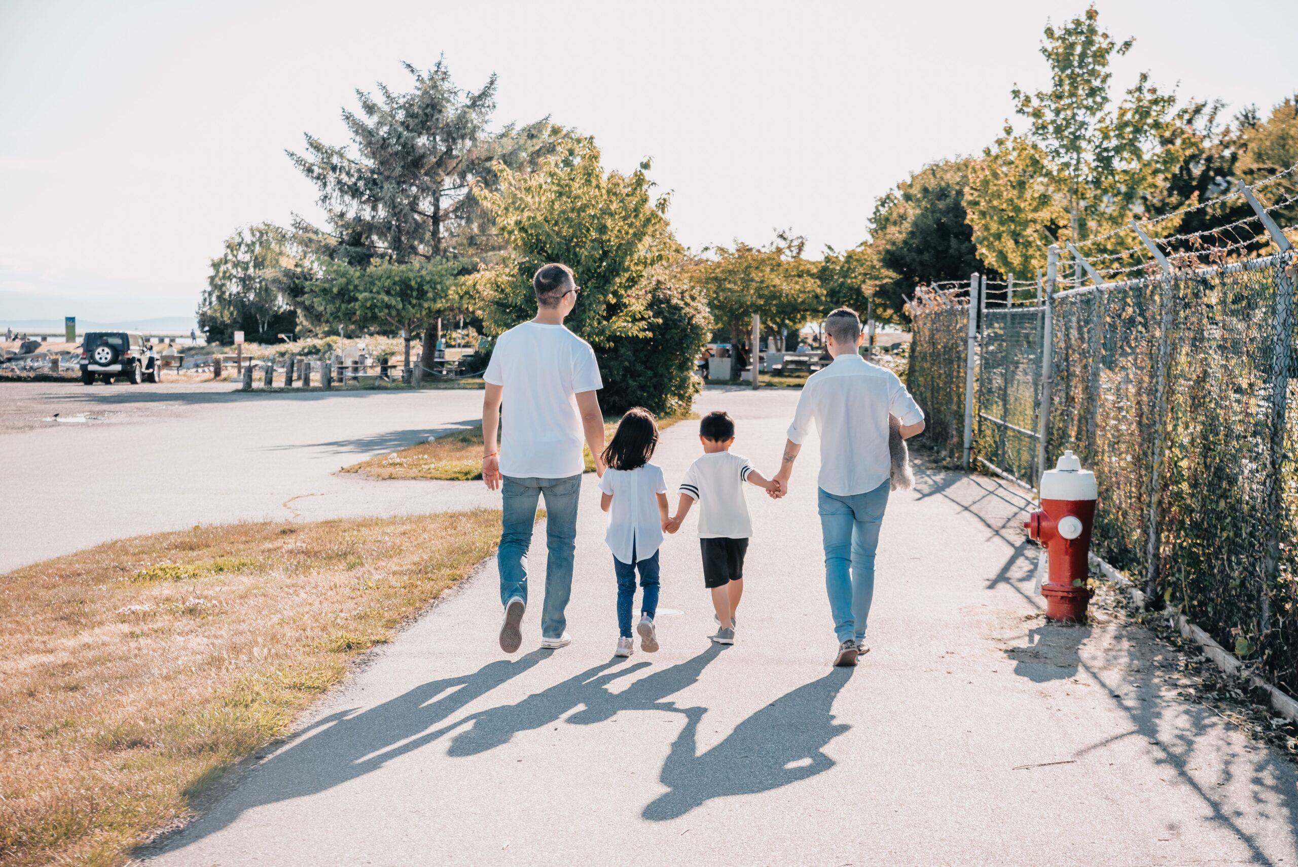 Happy family walking together outdoors in nature