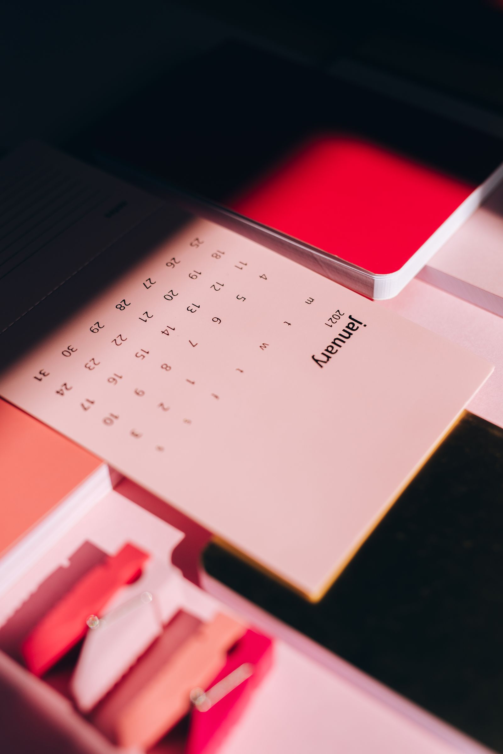 Person marking dates on a calendar