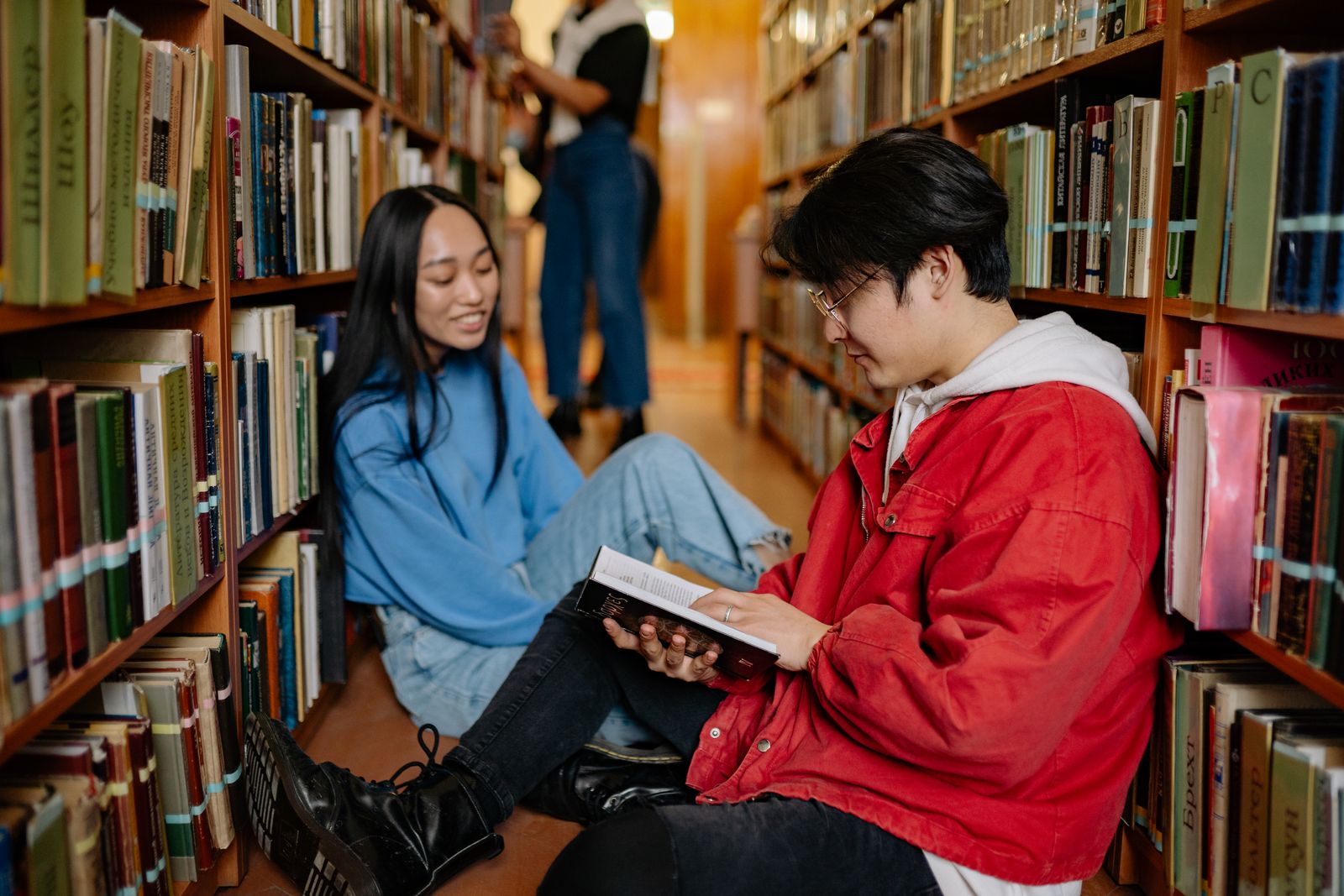 Person studying English words in a book