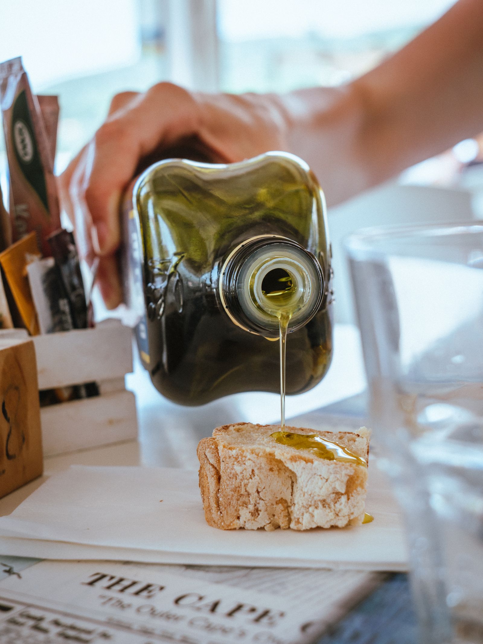 Olive oil being poured from a bottle