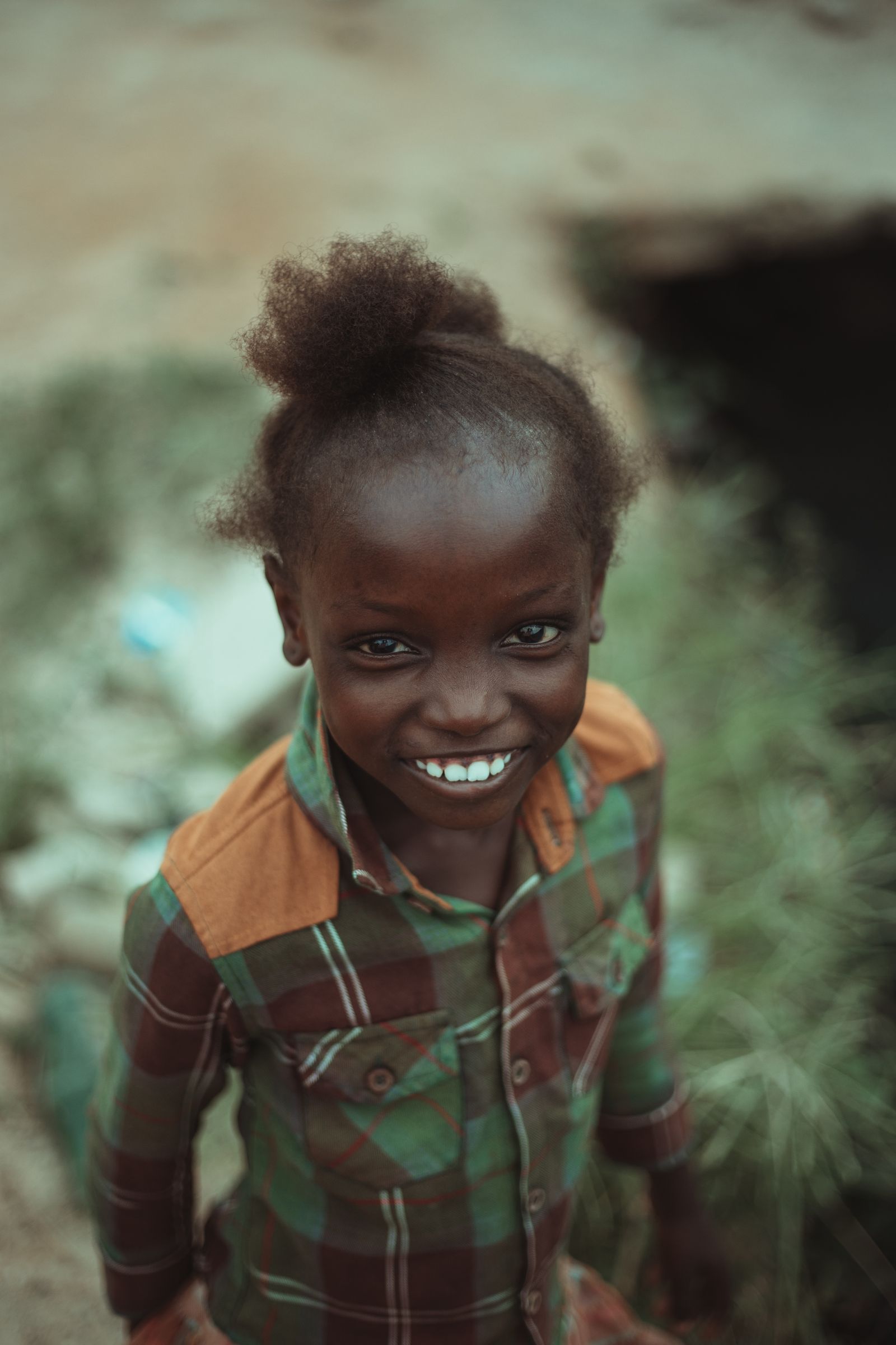 Young girl smiling in a portrait outdoors