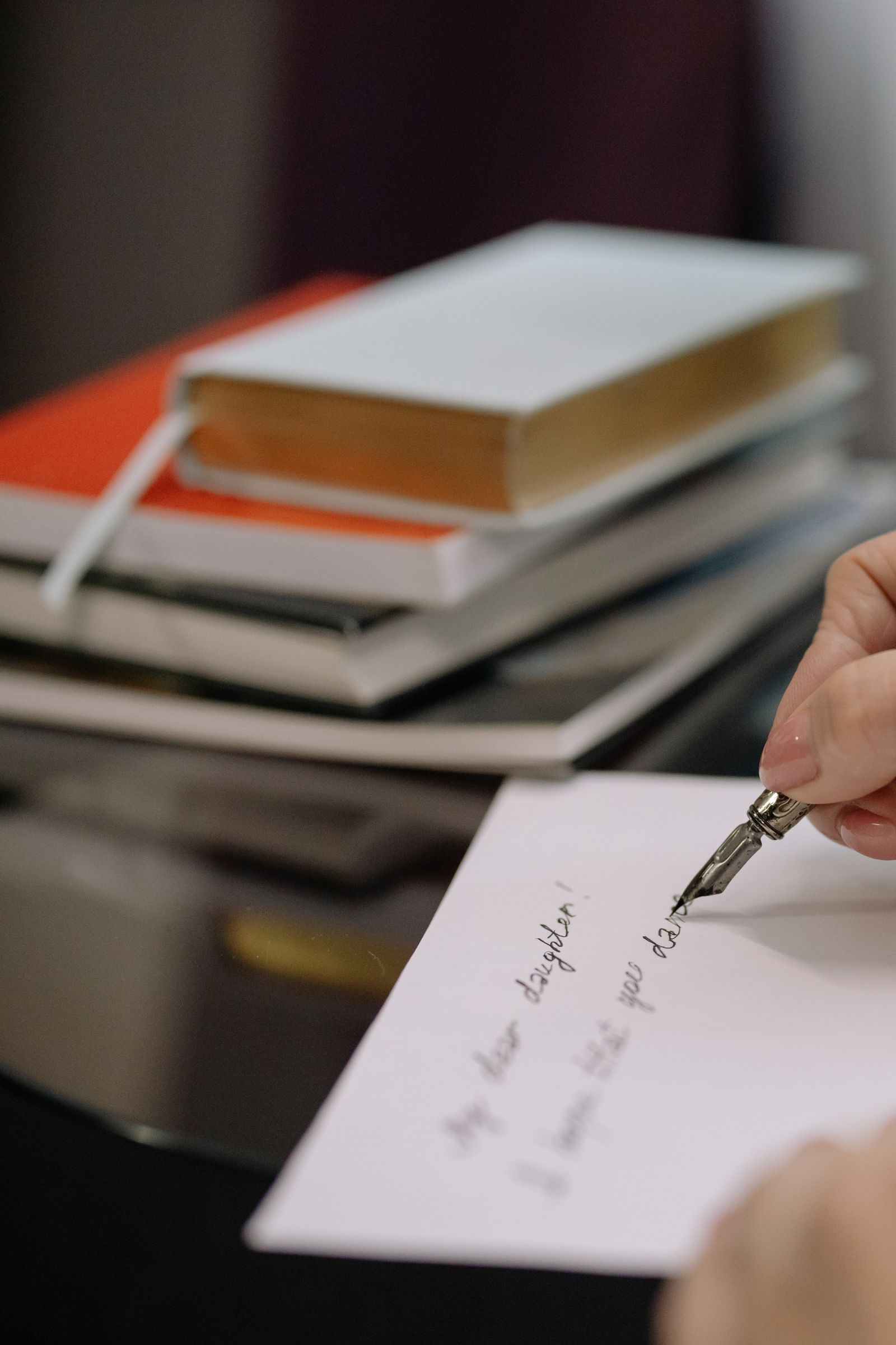 Close-up of pen writing on paper