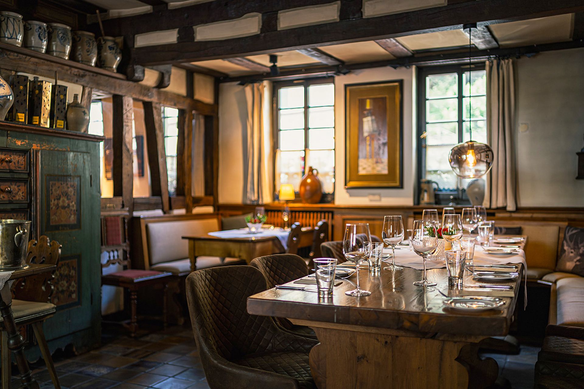 Traditional German restaurant interior with timber beams and set tables