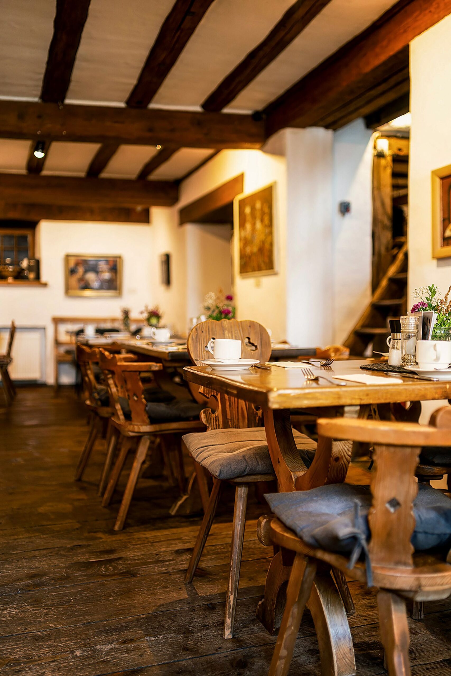 Cozy rustic German restaurant dining room with wooden furniture
