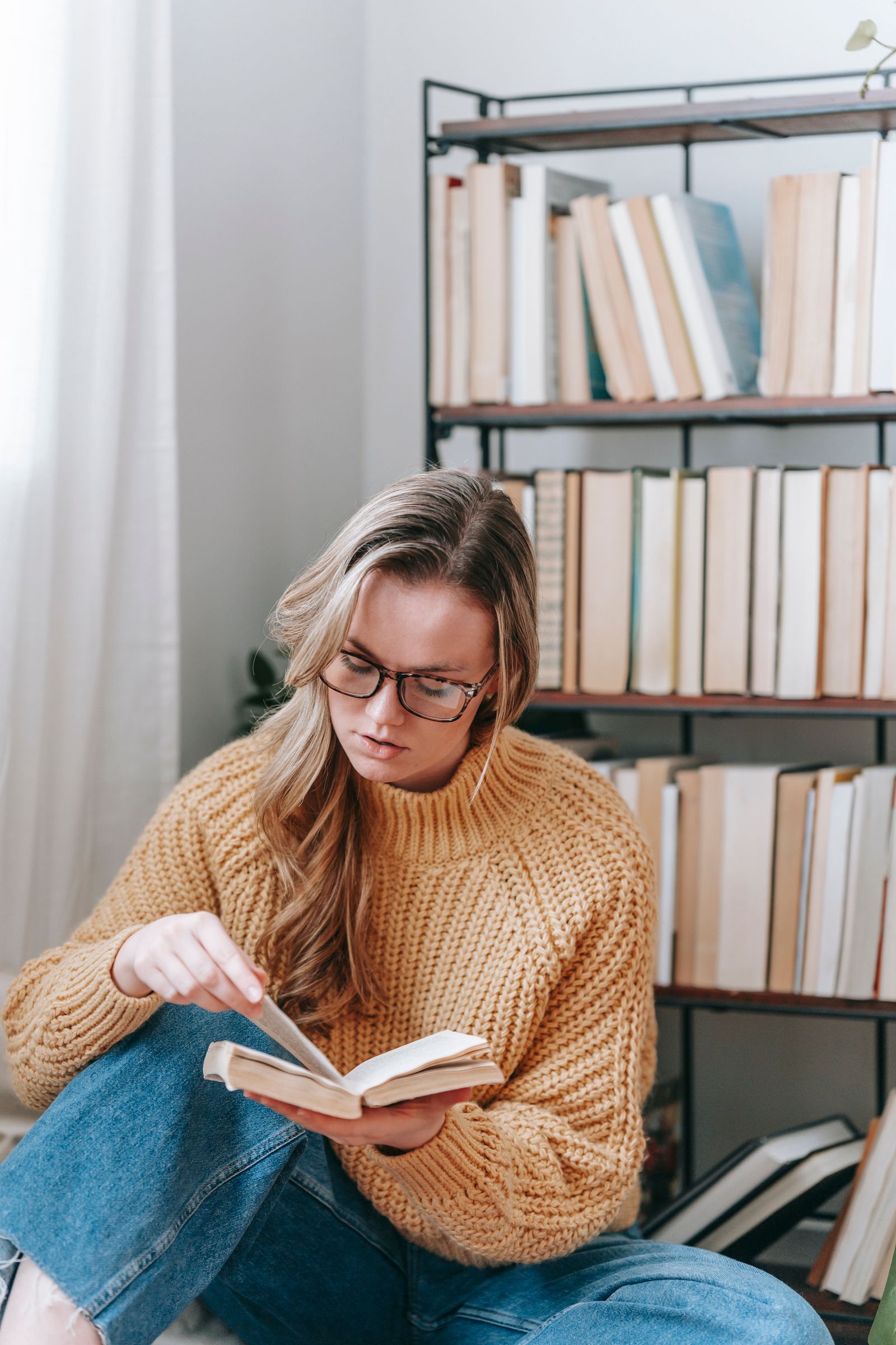 Person reading a book aloud while learning a language