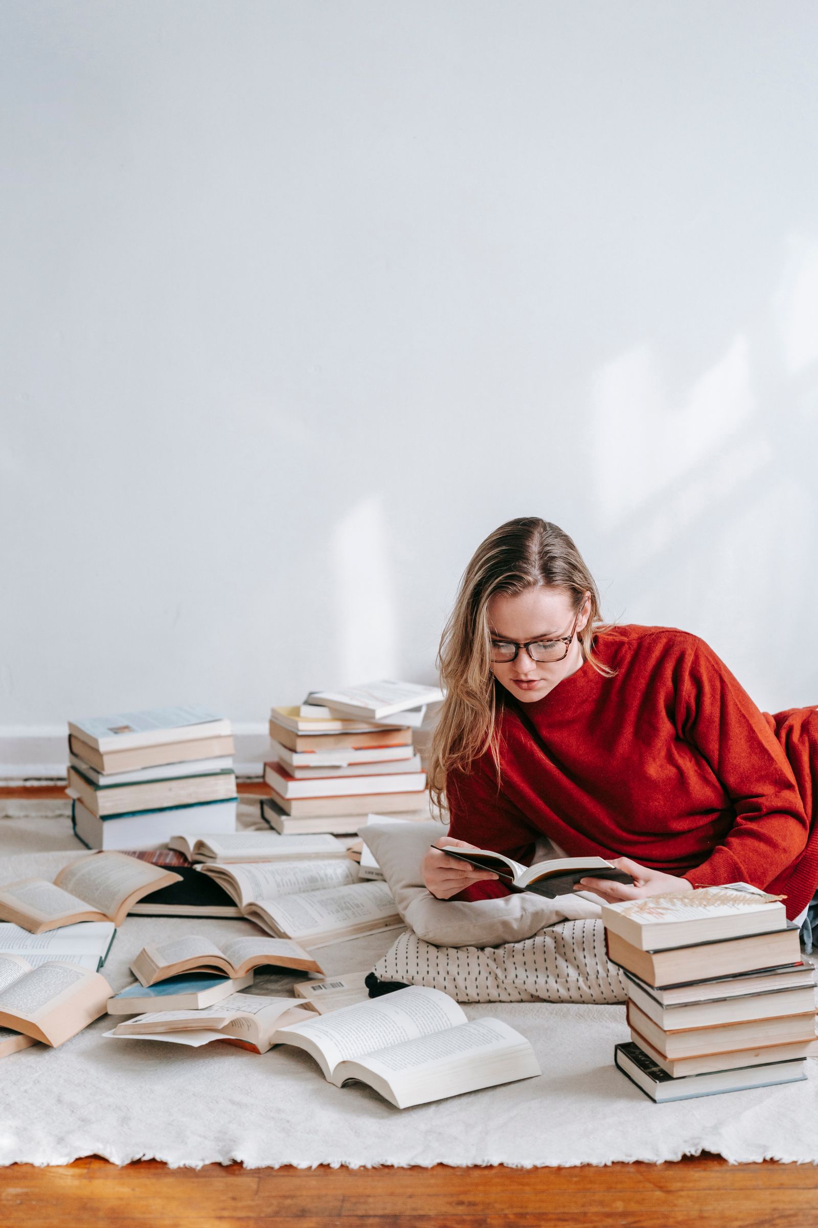 Person reading a book aloud while learning a language