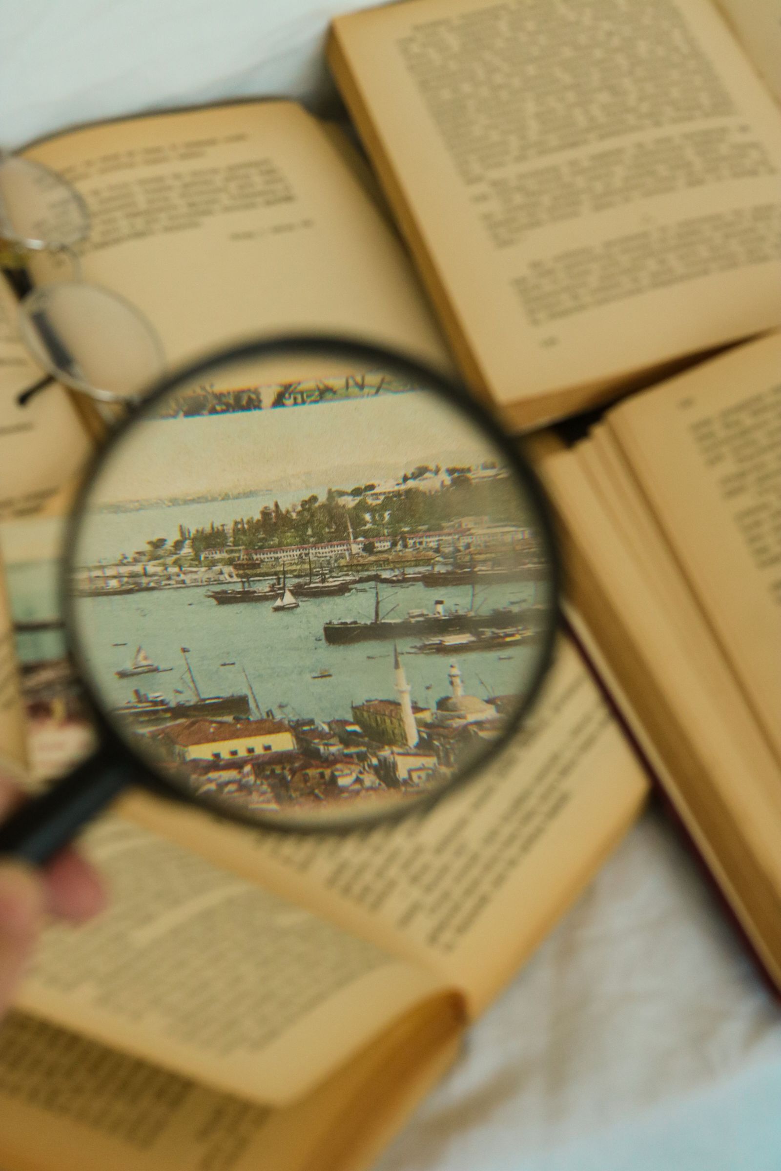 Magnifying glass lying beside a photograph